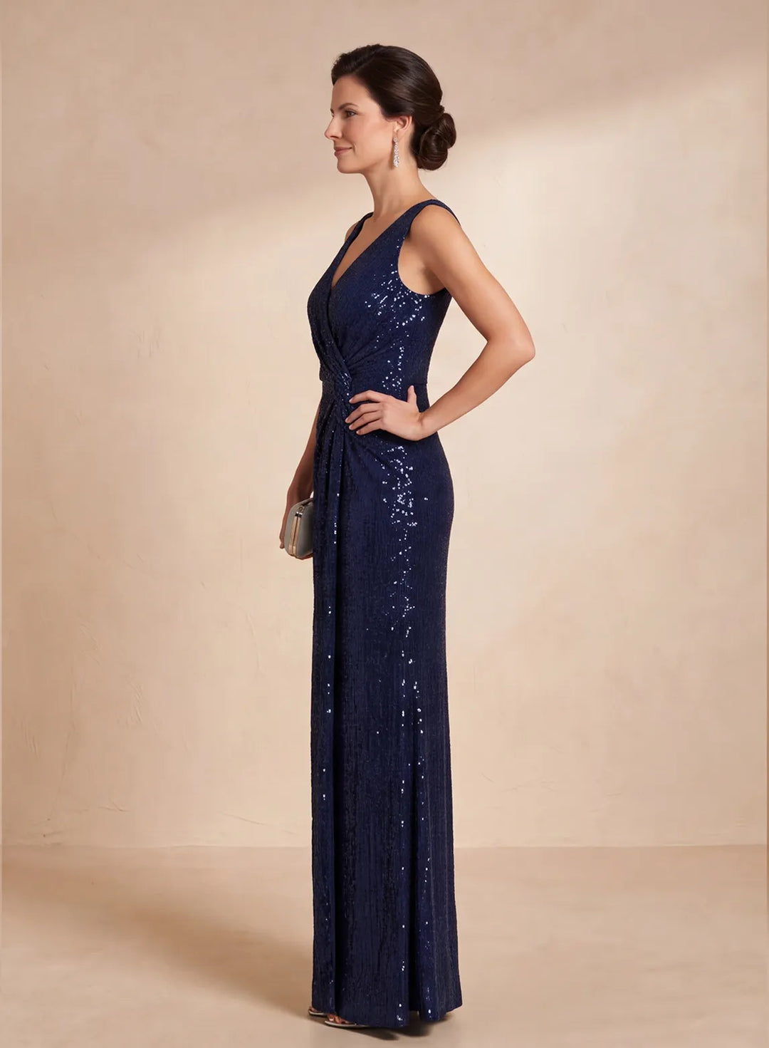 Side view of navy blue sleeveless sequin evening gown