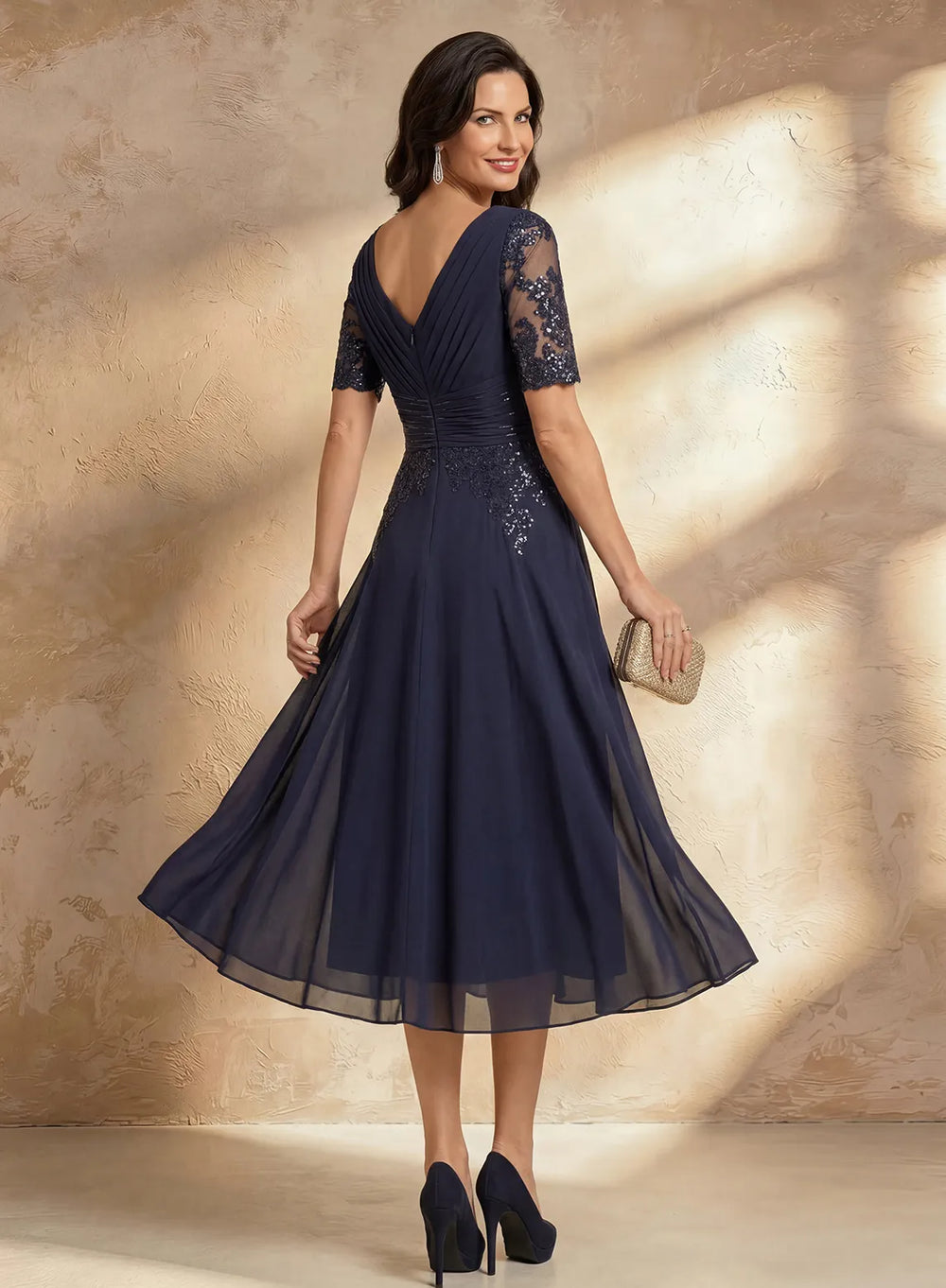 Elegant navy mother of the bride midi dress with flowing skirt for wedding occasions
