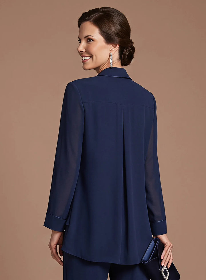 Close-up of the back of a navy blue chiffon jacket with a graceful draped silhouette.