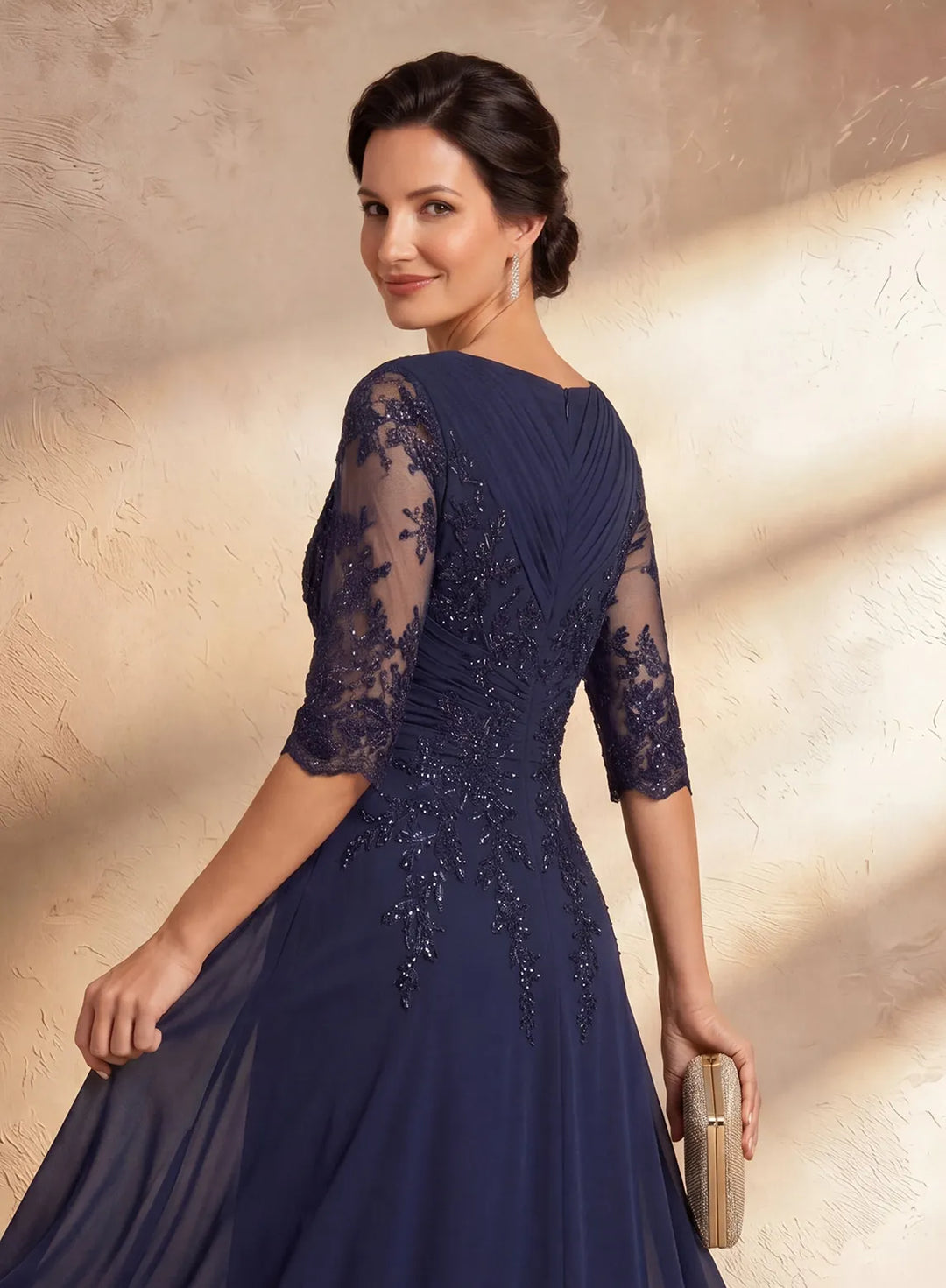 Elegant navy wedding guest dress with lace sleeves for formal occasions