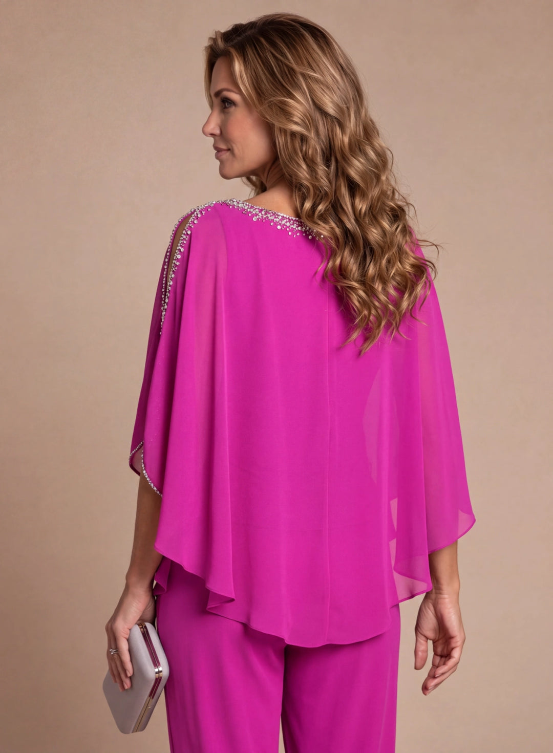 Back detail of elegant pink cape top for special occasion pantsuit