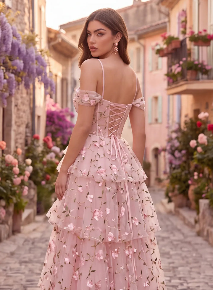 Back view of pink floral lace prom dress with corset lace-up back and spaghetti straps