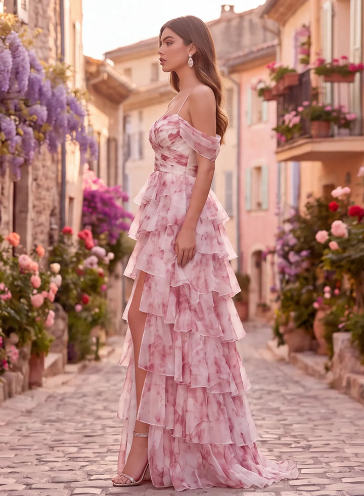 Side view of pink organza prom dress with layered ruffle skirt and high slit
