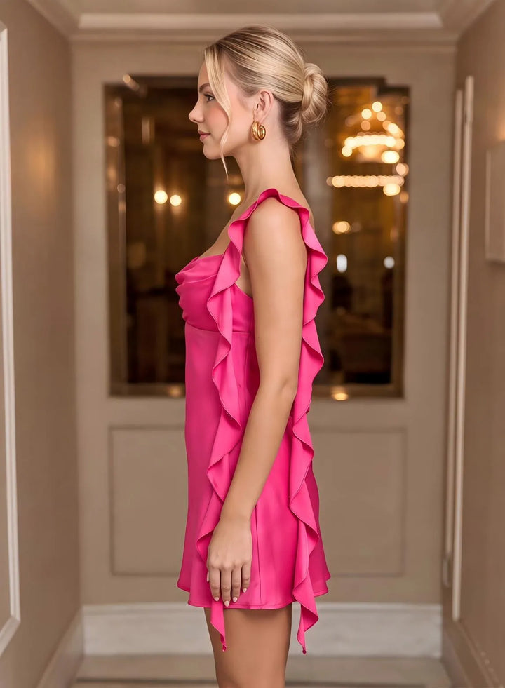 Close up of pink satin dress ruffle detail and silky fabric texture