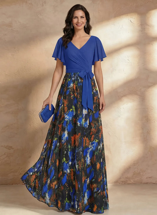 Elegant royal blue floral mother of the bride maxi dress with flutter sleeves and chiffon skirt