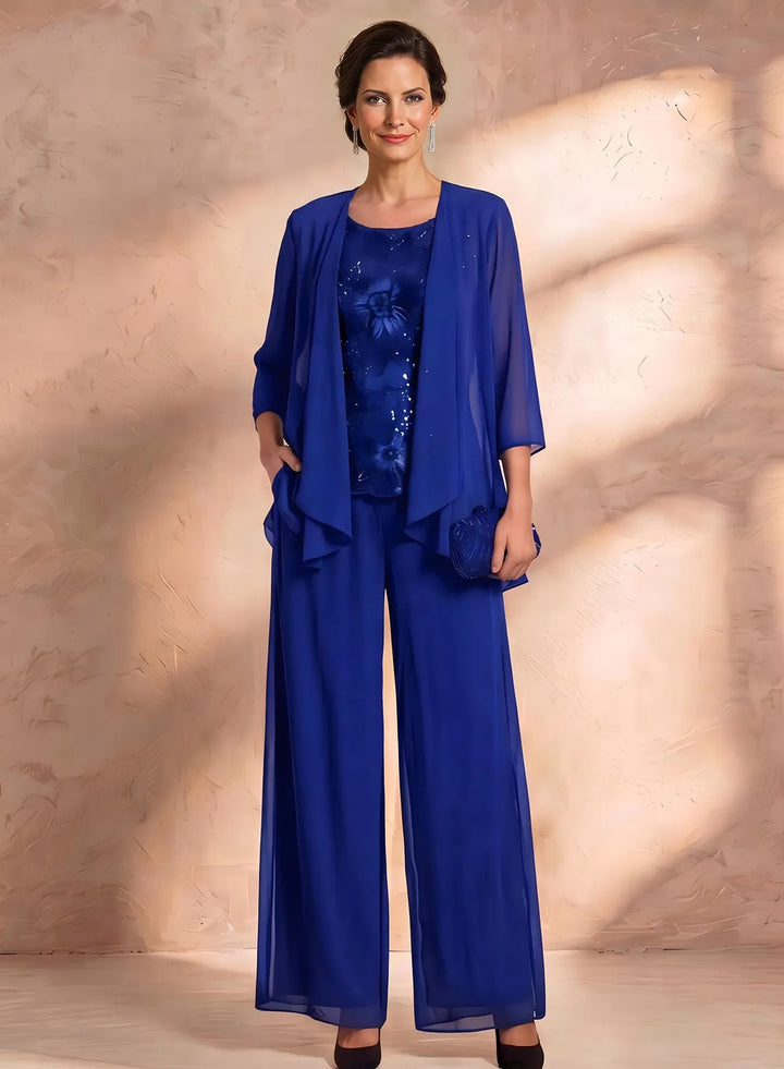 Royal blue mother of the bride pantsuit with elegant lace top and matching jacket