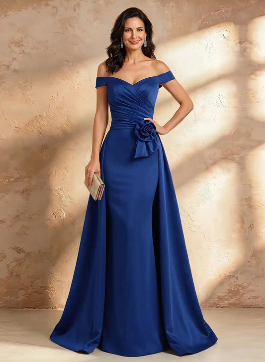 Elegant royal blue off shoulder mother of the bride gown with ruched bodice and floral waist detail