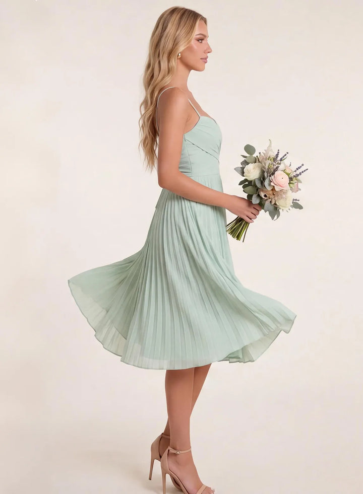 Sage green chiffon pleated bridesmaid dress side view with flowing skirt