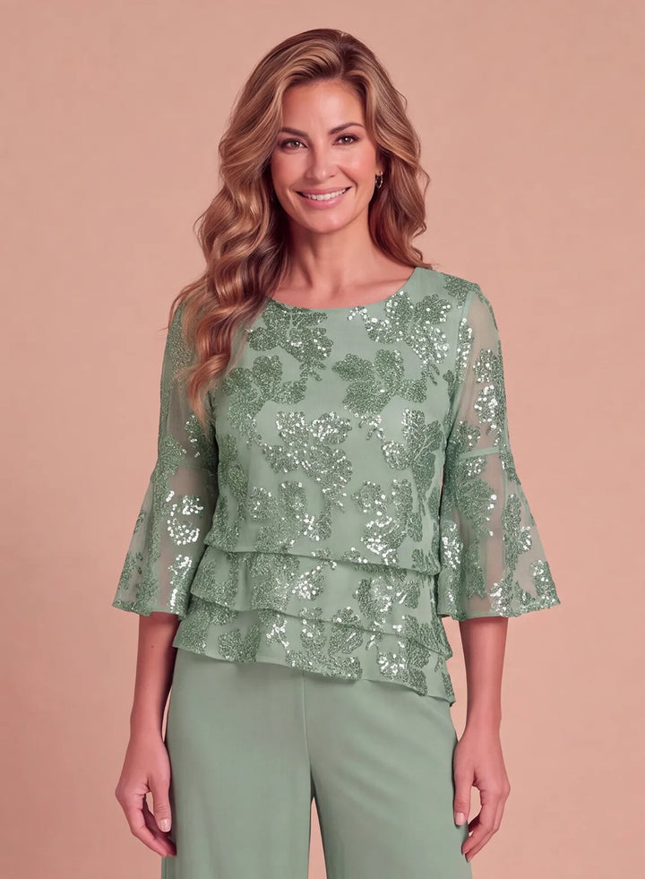 Front view of sage green floral sequin top with layered ruffle hem and three-quarter sleeves