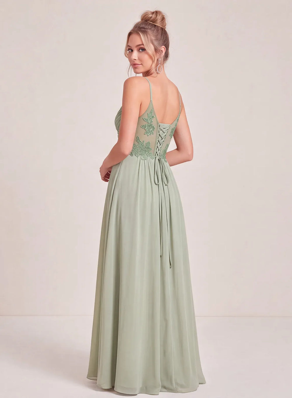 Sage green long bridesmaid gown with elegant floor length silhouette