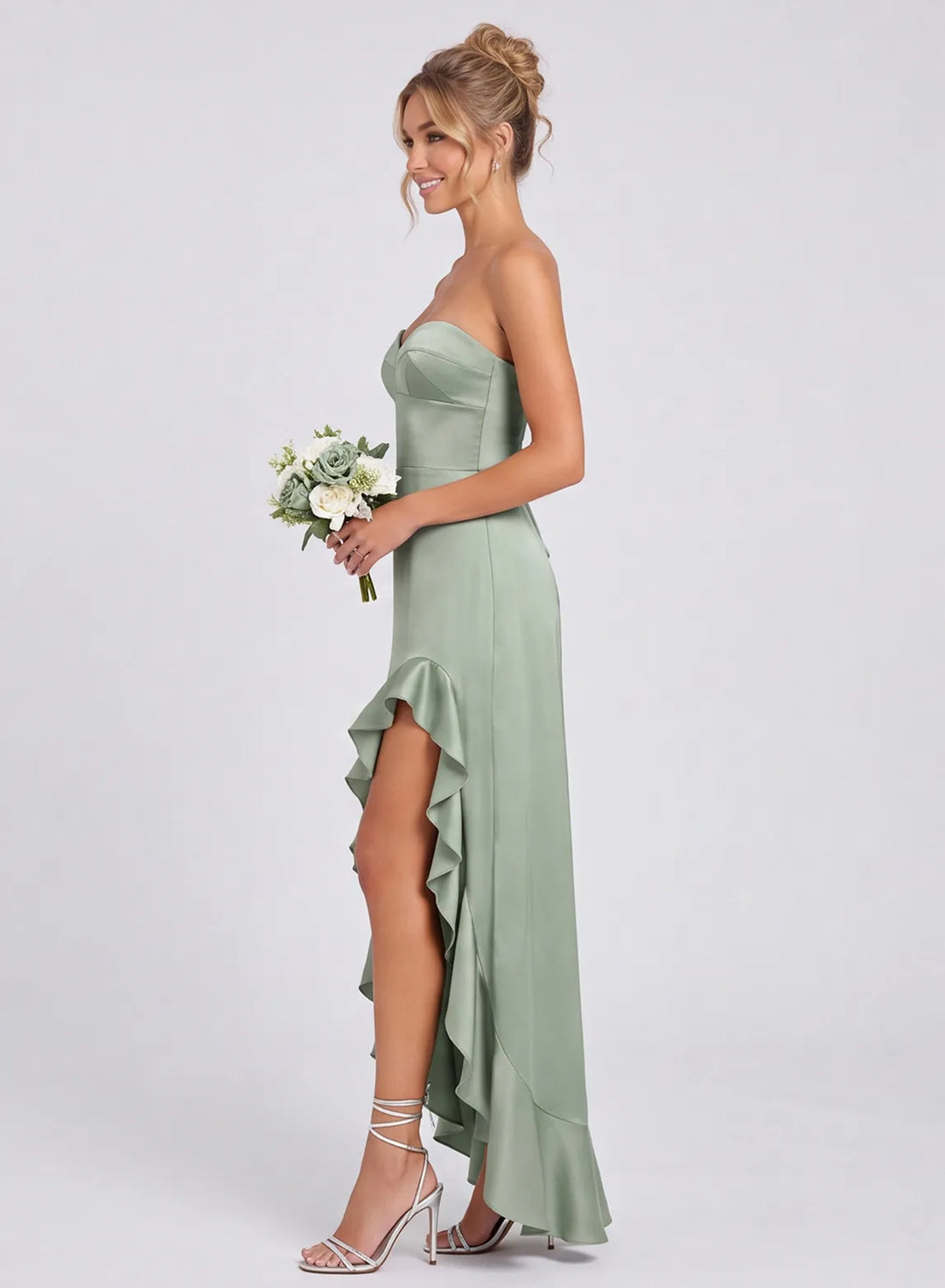 Side view of sage green satin strapless ruffle bridesmaid dress
