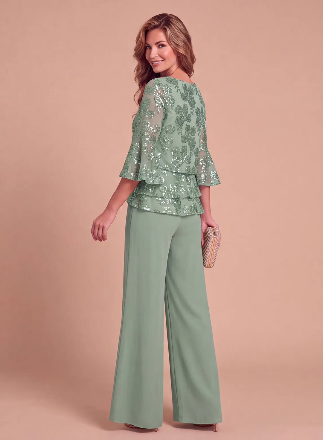 Side view of sage green formal pantsuit with floral sequin top and flowing wide-leg pants