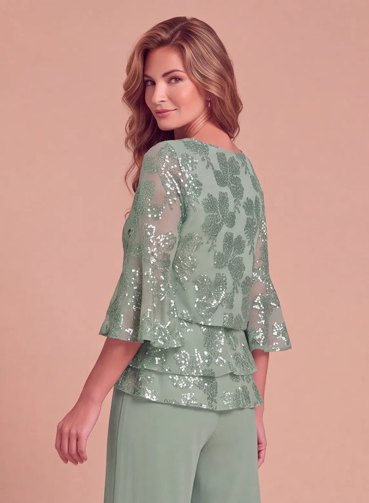 Back view of sage green formal pantsuit featuring floral sequin embellishments and layered ruffle details
