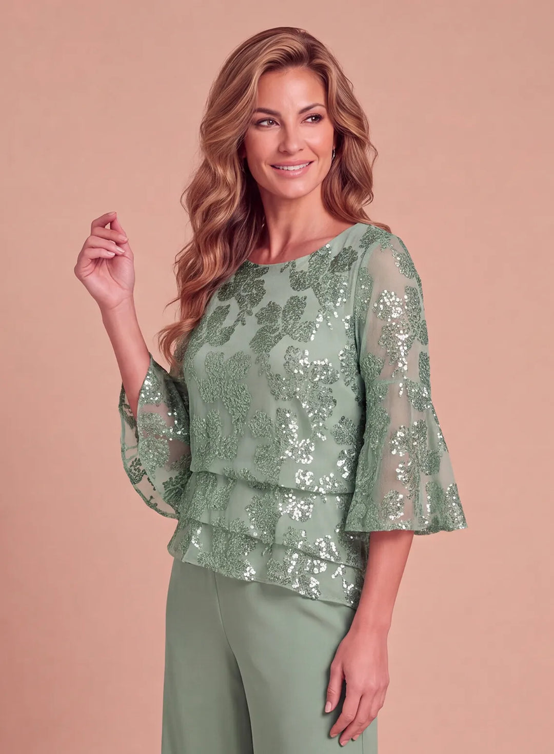 Front view of sage green formal pantsuit featuring floral sequin embellishments and layered ruffle details