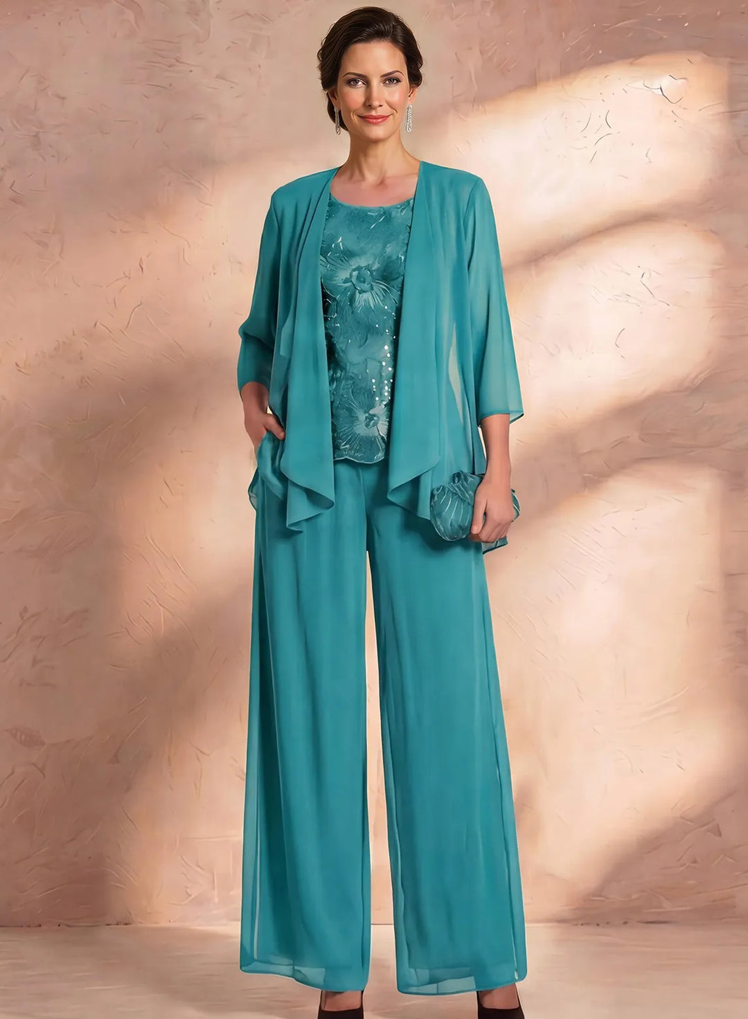 Teal mother of the bride pantsuit with lace blouse and chiffon jacket, sophisticated formal outfit