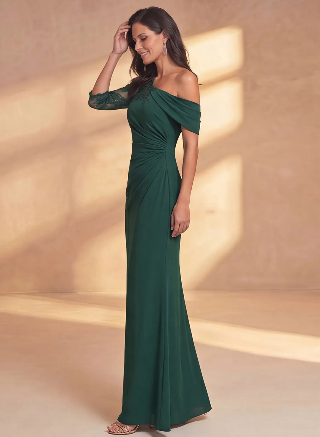 Emerald green formal mother of the bride dress featuring an asymmetric one shoulder neckline