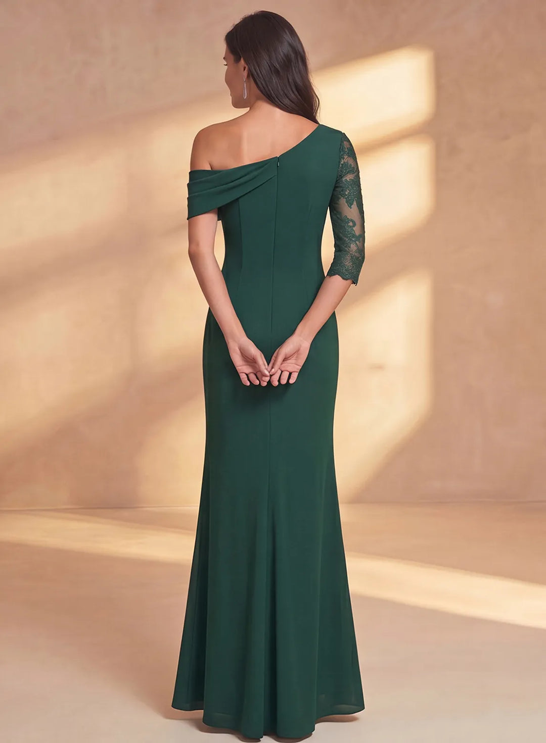 Back view of emerald green mother of the bride dress with sheer lace sleeve and elegant design